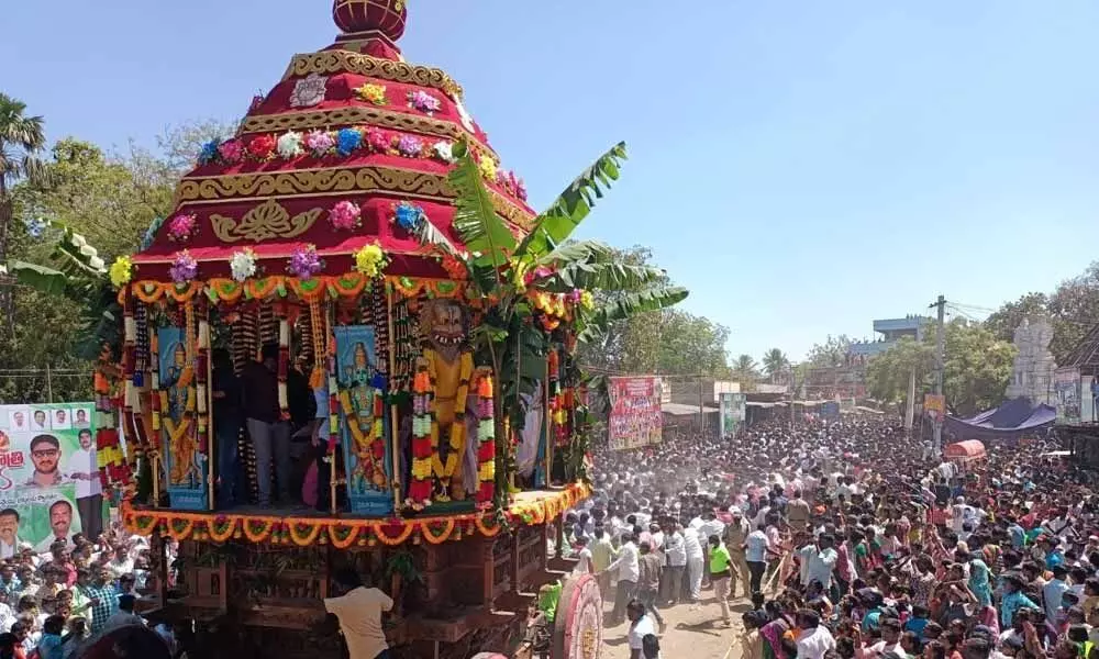 Devotees pulling the chariot of Parvati Sameta Nirmamaheswara Swamy  in Podili on Friday