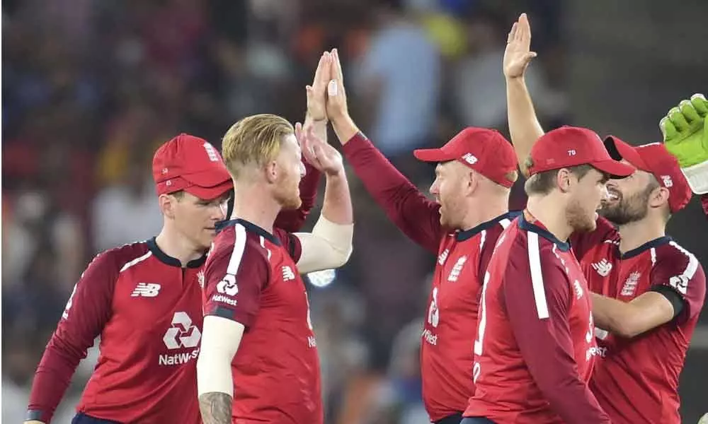 England bowler Ben Stokes (2from left) celebrates with teammates the wicket of India’s Rishabh Pant during the first T20 at the cricket stadium in Sardar Vallabhai Patel Sports Enclave, Ahmedabad on Friday