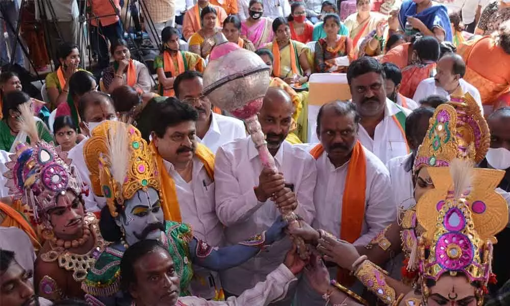 BJP MLC candidate N Ramachandra Rao and TRS candidate S Vanidevi campaigning for Sunday graduate MLC polls