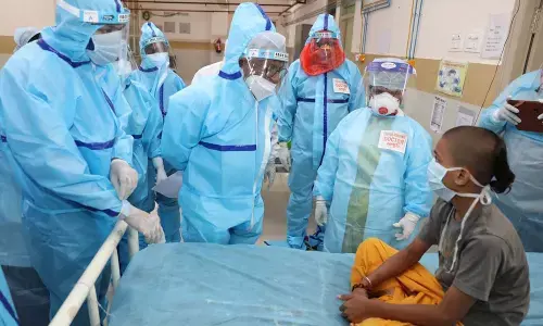 TTD Chairman  Y V Subba Reddy along with EO Dr K S Jawahar Reddy speaks to a Veda Pathashala student who is in observation after being tested positive at SVIMS on Friday