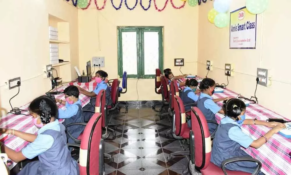 Students of Government Residential School for the Visually-Challenged Girls learning Braille during a demonstration of Annie smart class in Visakhapatnam
