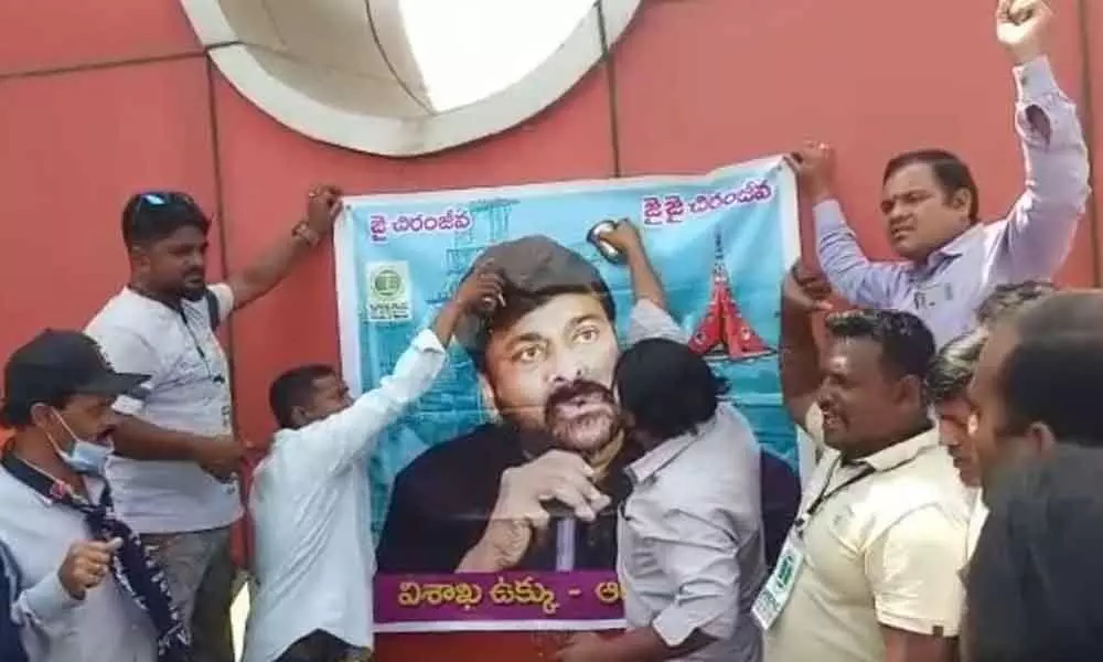 Visakhapatnam Steel Plant workers performing ‘Palabhishekam’ to the image of actor K Chiranjeevi for extending his support to Ukku stir in Visakhapatnam on Saturday