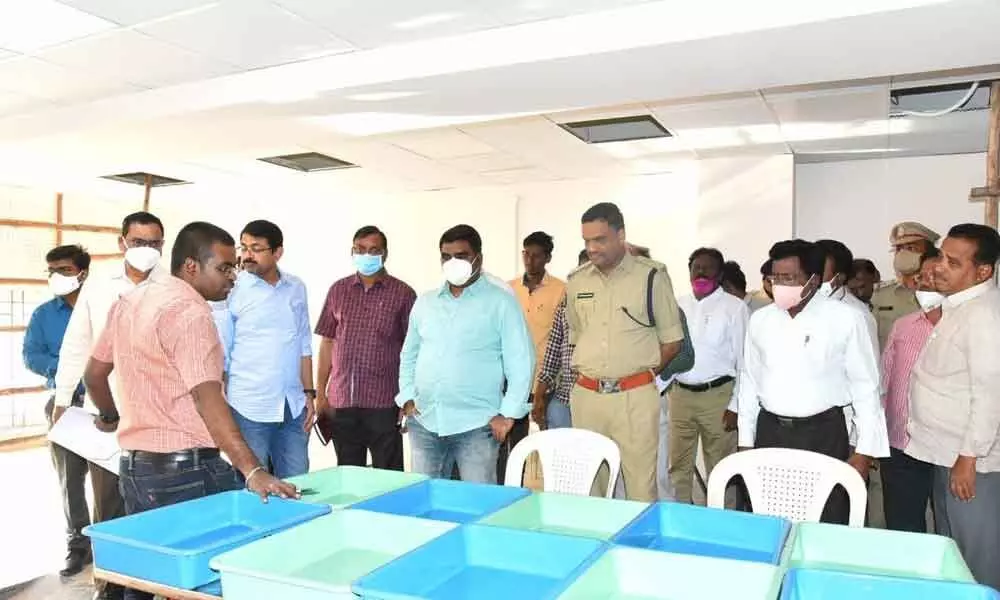 Collector G Veera Pandian inspects arrangements for counting of votes for municipal elections, in Kurnool on Saturday