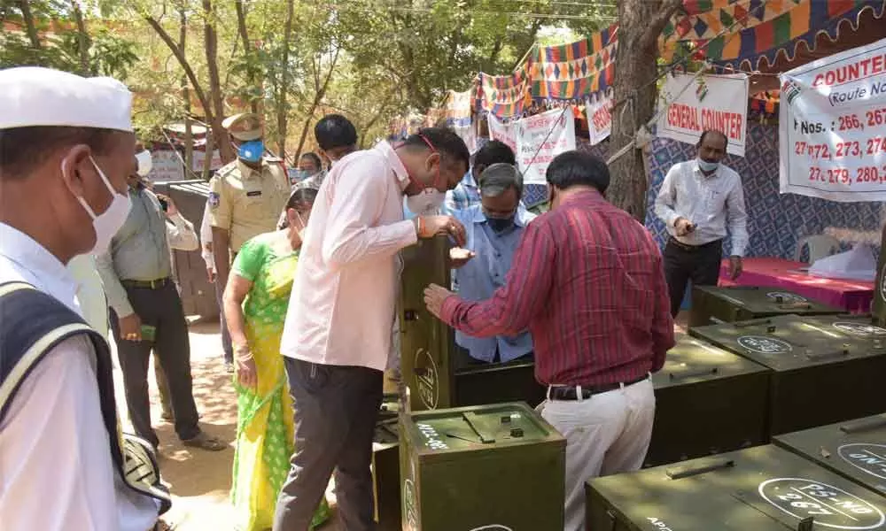 District Collector RV Karnan inspecting ballot boxes at the distribution centre at SR&BGNR College in Khammam on Saturday