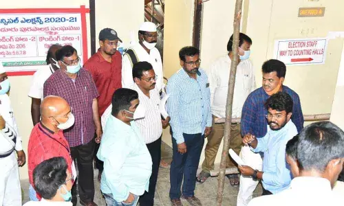 District Collector G Veera Pandiyan along with Municipal Commissioner D K Balaji inspecting the counting centres at Rayalaseema University in Kurnool on Saturday.