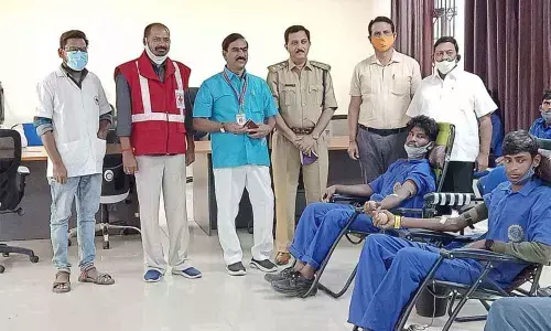 Mahbubnagar District Red Cross Society Chairman Lion Nataraj and Mahbubnagar RTA Srinivas Reddy at a blood donation camp at L&T Training Centre in Jadcherla on Saturday