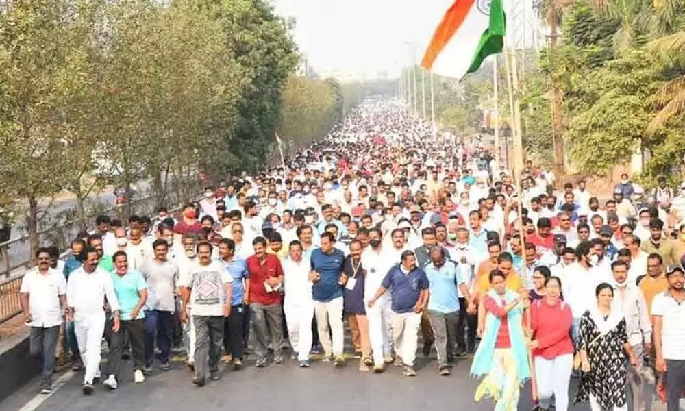 A large number of people taking part in the walkathon organised by Visakha Ukku Parirakshana Porata Committee in Visakhapatnam on Sunday