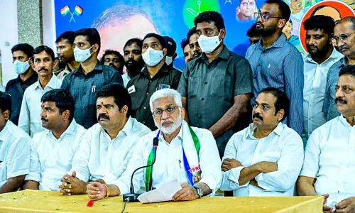 YSRCP Rajya Sabha MP V Vijayasai Reddy speaking at a media conference in Visakhapatnam on Sunday. Ministers Muttamsetti Srinivasa Rao and K Kannababu are also seen.