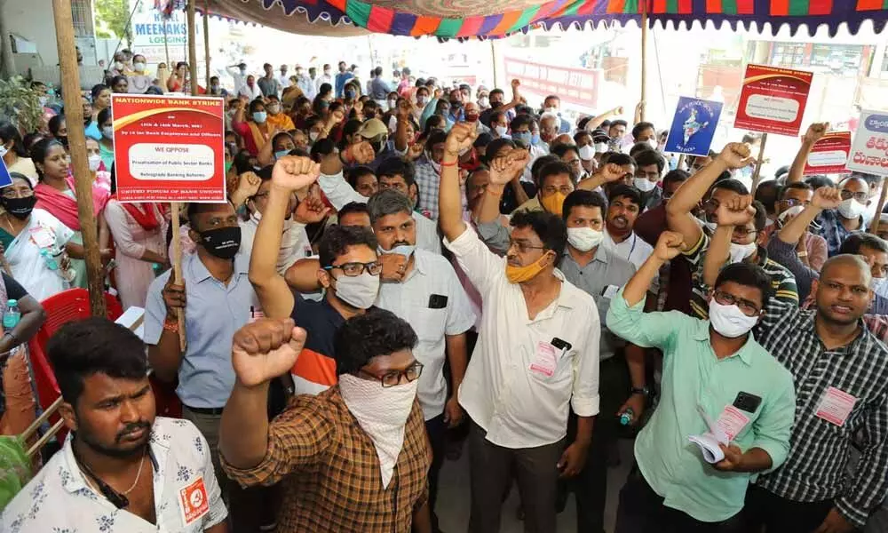 Bank employees under the aegis of United Forum of Bank Union Employees staging dharna in Tirupati on Monday