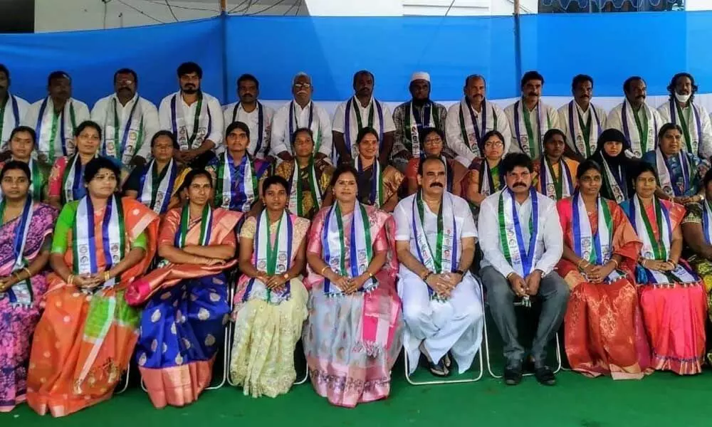 Balineni Srinivasa Reddy with the corporator candidates won in the OMC elections, at his house in Ongole on Monday
