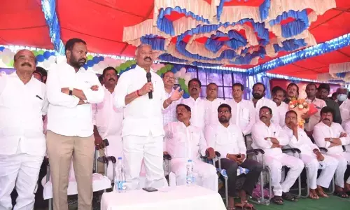 Panchayat Raj Minister Peddireddi Ramachandra Reddy addressing a press meet at Boyakonda Gangamma temple in Punganur on Monday. Deputy Chief Minister K Narayanaswamy is also seen