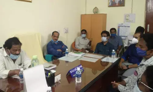 District Medical and Health officer in-charge Dr N Prasanna Kumar addressing in the meeting at DMHO  office in Kakinada on Monday