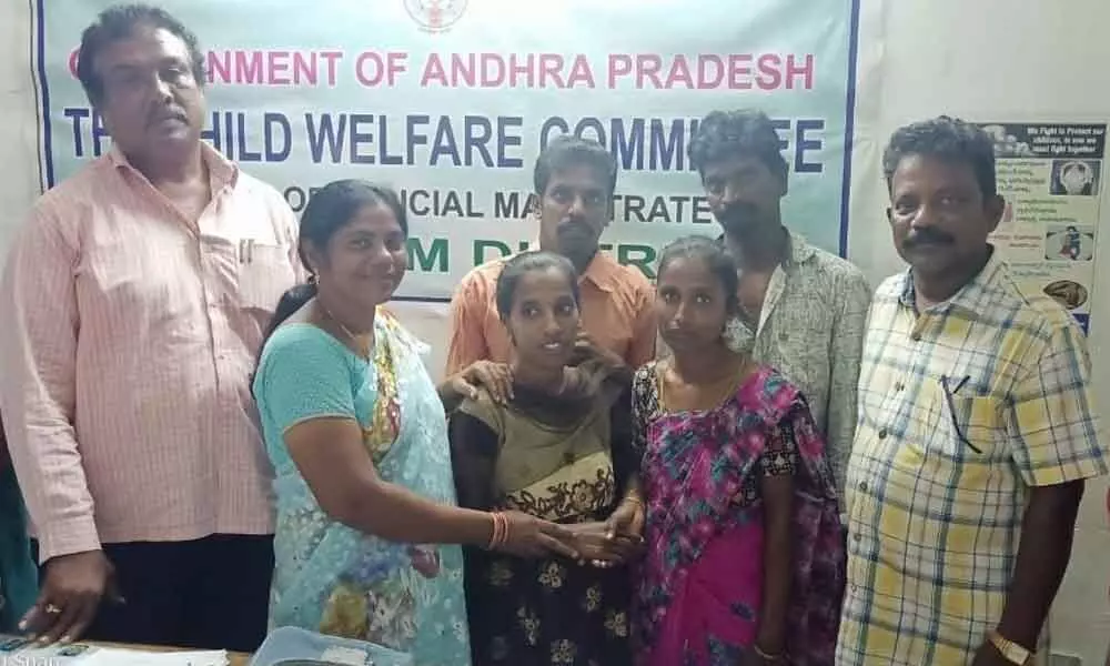 Prakasam District CWC members reuniting a girl with her family in Ongole on Wednesday