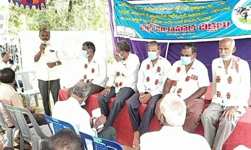 Employees protesting in front of Ongole Dairy on Wednesday