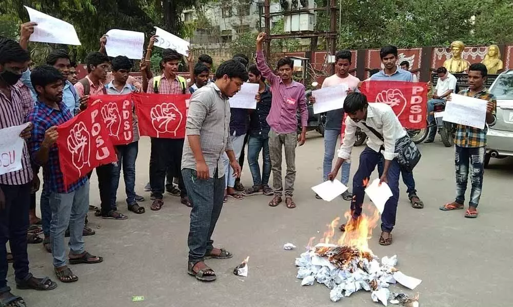 PDSU leaders burning copies of State budget in Khammam on Thursday
