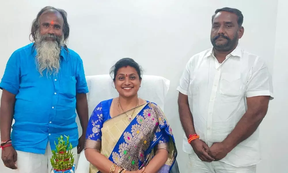 Nagari MLA R K Roja with the newly elected Puttur municipal chairman A Hari (left) and D Shankar vice-chairman after their election in the special meeting in Puttur municipality on Thursday