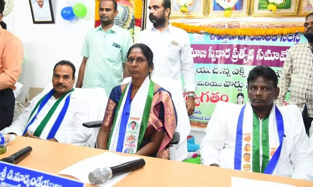 Mayor N Amuda speaking to media after election in Chittoor on Thursday. MLA  A Srinivasulu (right) is also seen