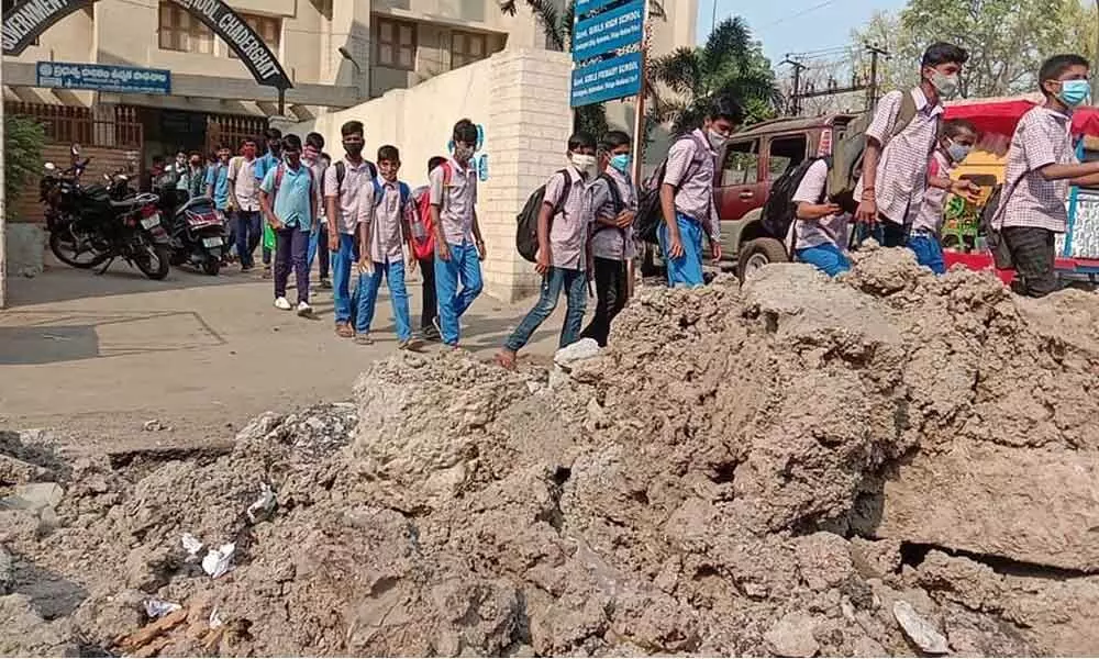 Dug up road in Chaderghat proves dicey for school staff, students