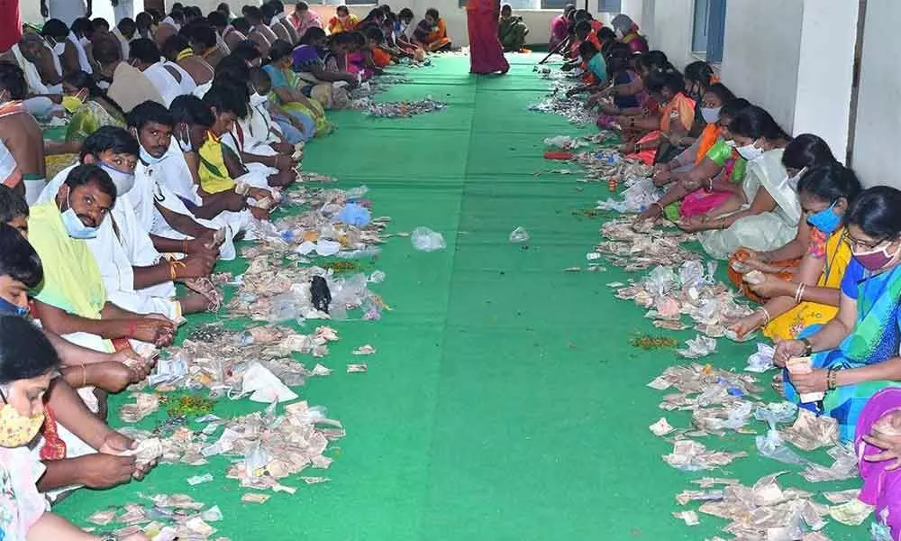 The staff of Srisailam temple engaged in counting the hundi collection