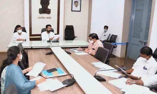 District Collector D Muralidhar Reddy along with Kakinada Municipal Commissioner Swapnil DinakarPundkar addressing a meeting in Kakinada