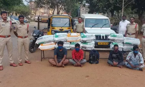 CI T Swamy producing seized ganja and four smugglers in Bhadrachalam on Sunday