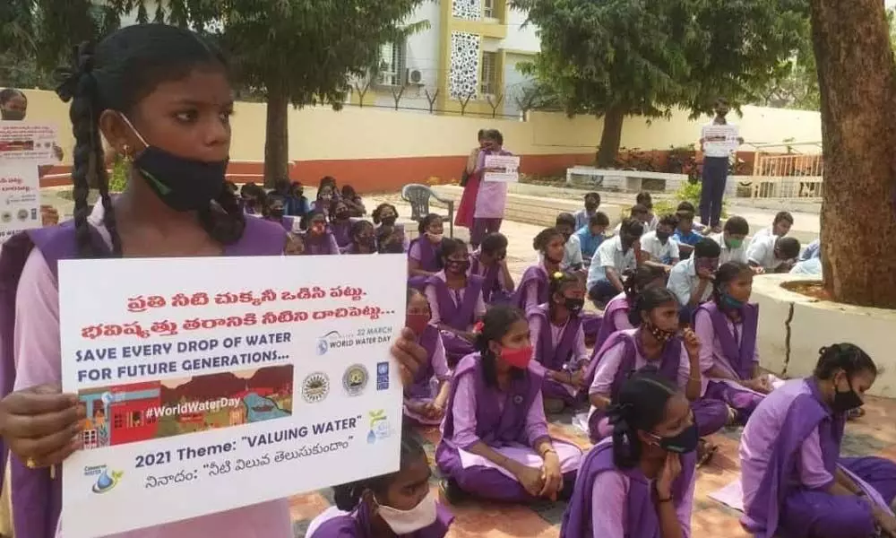 Students of  KDPM High School taking part in a water conservation programme in Visakhapatnam on Monday