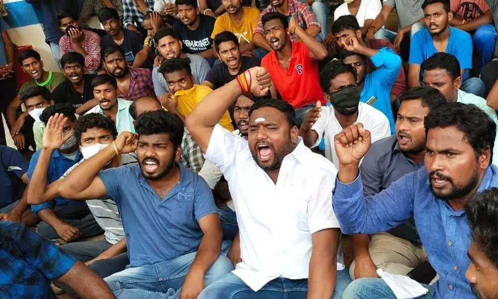 Students staging protest in front of Vice-Chancellors building in Kakatiya University in Hanamkonda on Wednesday