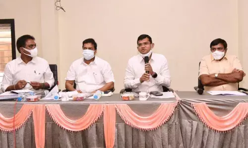 Kakinada Municipal Commissioner Swapnil Dinakar Pundkar addressing a meeting along with Kakinada City MLA Dwarampudi Chandrasekhar Reddy in Kakinada