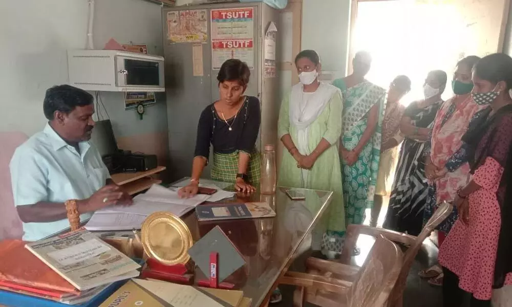 DEO Govind Rajulu inspecting KGBV records at Kodair mandal in Nagarkurnool district on Friday, before issuing suspension orders to Special Officer