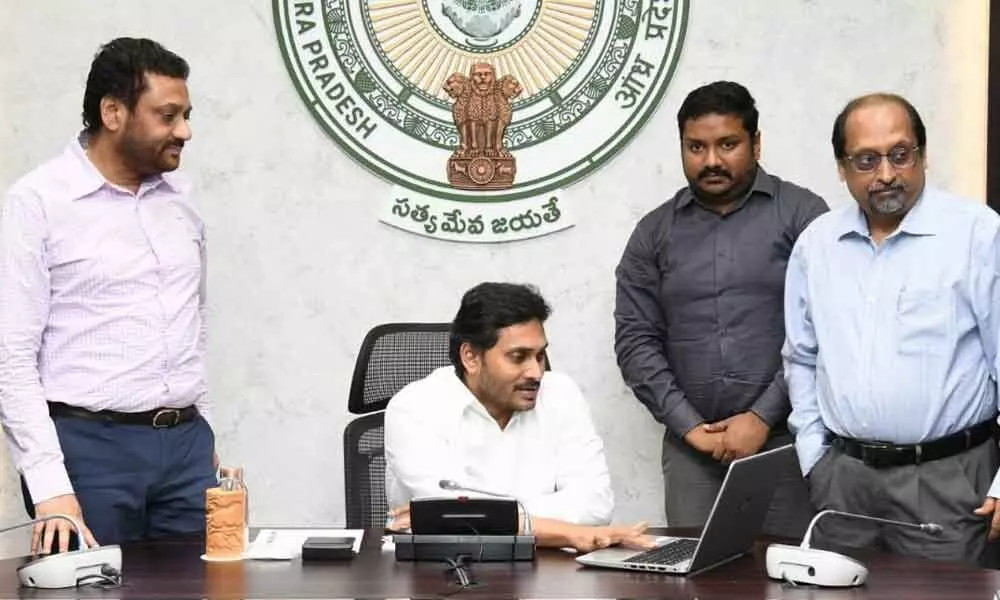 Chief Minister Y S Jagan Mohan Reddy launches the updated Spandana portal at his camp office in Tadepalli on Friday