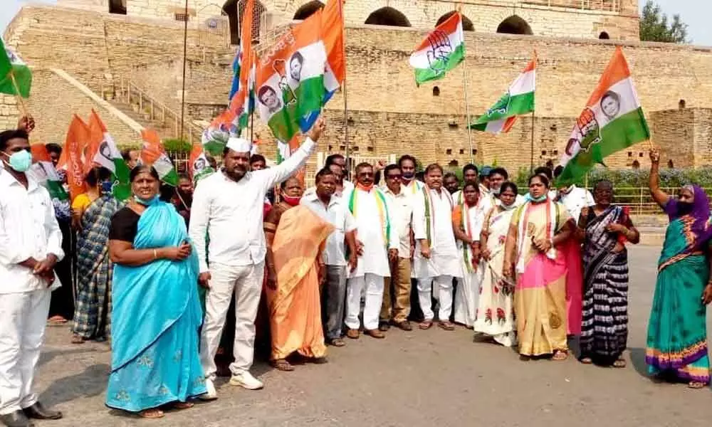 Congress activists staging a dharna in Kurnool on Friday