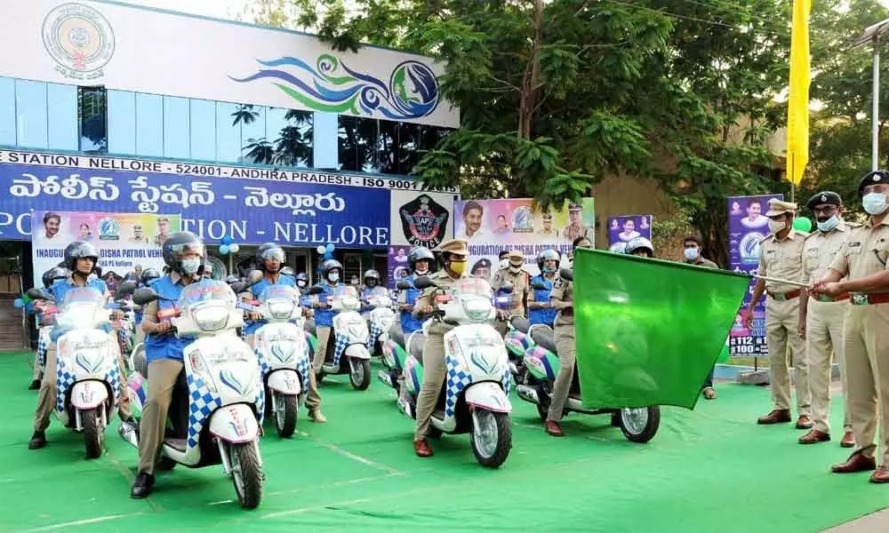 SP Bhaskar Bhushan formally flagging off vehicles allotted to Disha Police Station in Nellore on Friday
