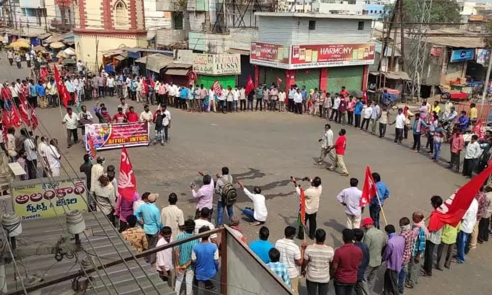 Leaders and cadres of Left parties form a human chain in support of Bharat Bandh in Vizianagaram on Friday