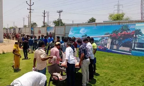 Subhash Reddy distributing essential items to the needy in Kamareddy during lockdown (file photo)
