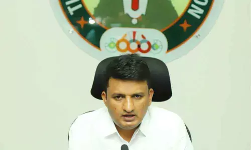 Municipal Commissioner P S Girisha addressing media over spike in corona cases at corporation office in Tirupati on Saturday