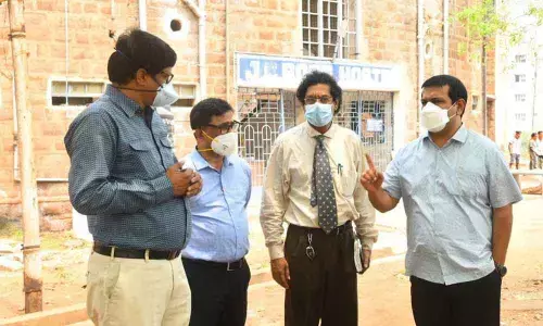 District Collector V Vinay Chand and District Covid Special Officer  PV Sudhakar along with others at Andhra University in Visakhapatnam