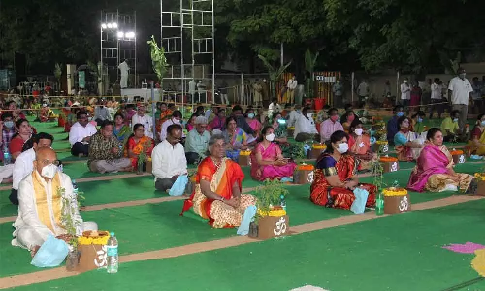 Devotees offering harathi at parade grounds as part of Lakshmi Jayanti in Tirupati on Sunday