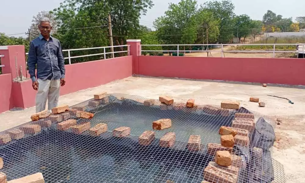 MS Subrahmanyan Raju experimenting at one of the farm ponds to arrest water evaporation