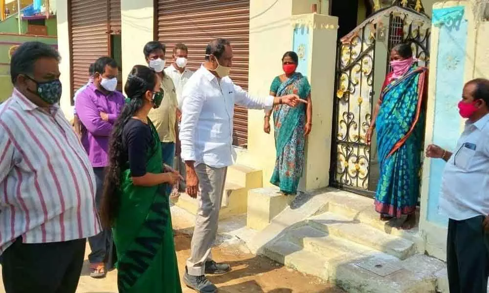 MLA Dr Sanjay Kumar and Municipal Chairperson B Shravani interacting with the people in Budugajangala Colony in  Jagtial town on Monday
