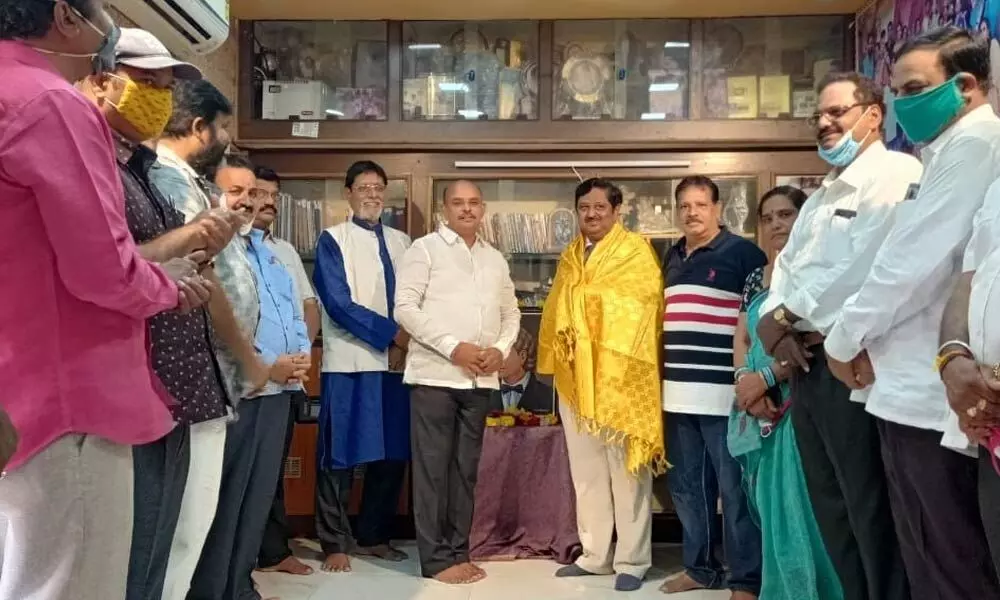 Ghantasala Gopi Krishna being felicitated at Brown Centre in Rajamahendravaram on Tuesday. YSRCP leader S Sivarama Subramanyam, Jit Mohan Mitra  (left) and Sannidhanam Sastry (right) also seen