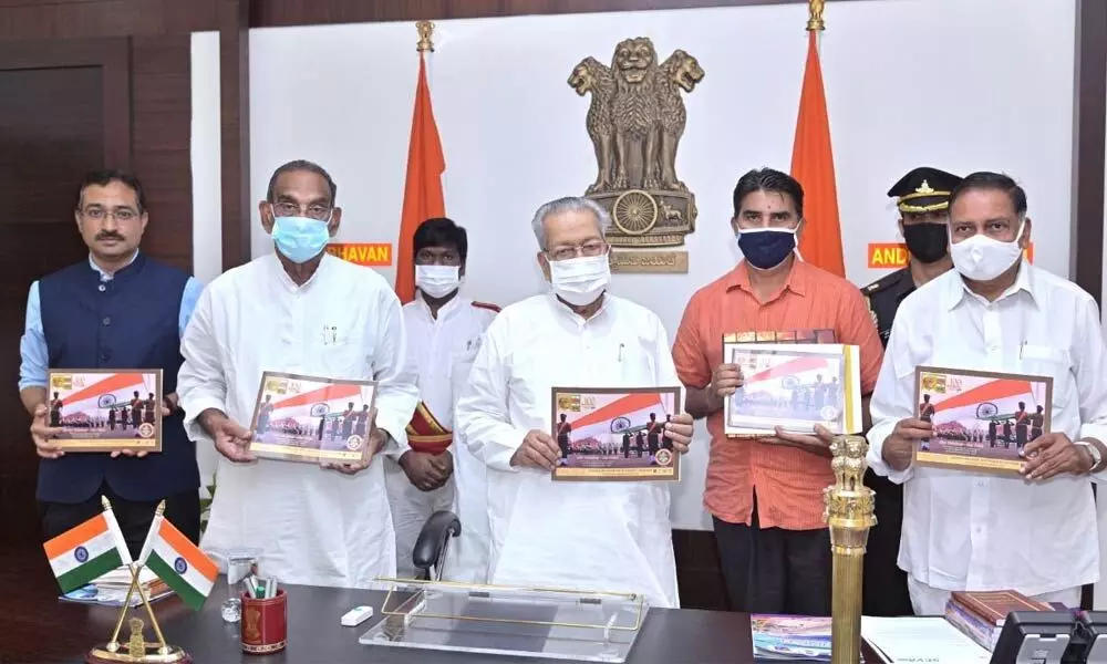 Governor Biswa Bhusan Harichandan releasing a catalogue to commemorate the centenary year of the nation’s tricolour design at Raj Bhavan on Tuesday