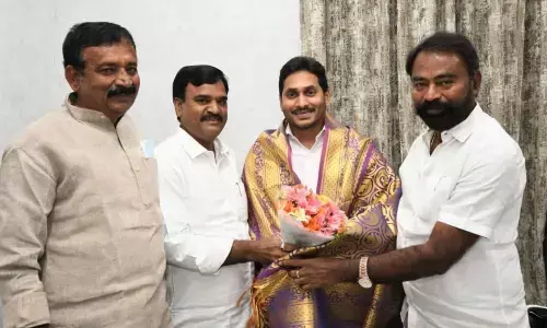 Kadapa Mayor K Suresh Babu felicitating Chief Minister YS Jagan Mohan Reddy at the latter’s camp office in Tadepalli on Tuesday.  Deputy CM Amzath Basha is also seen.