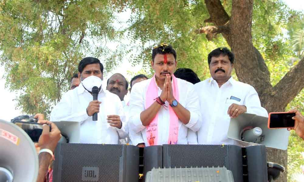 Energy Minister G Jagadish Reddy addressing the people during election campaign in Tripuraram mandal on Wednesday.