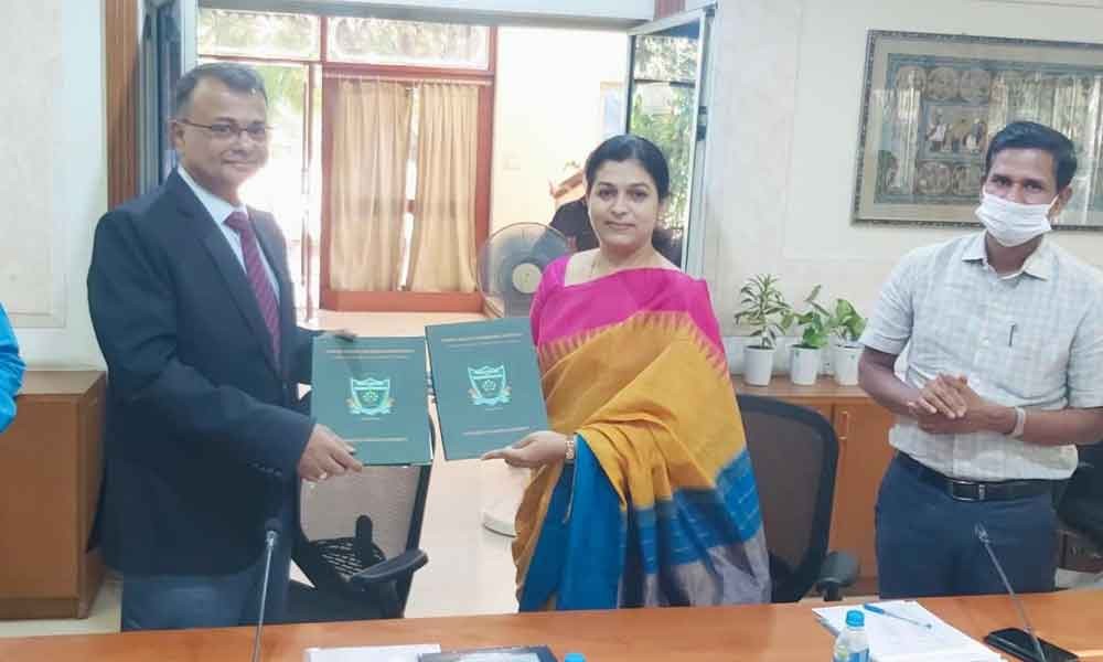 Adhar Sinha, the Special Chief Secretary and Director General of EPTRI, and Priyankaa Verghese, the Dean of Forest College and Research Institute, exchanging an MoU on Thursday.