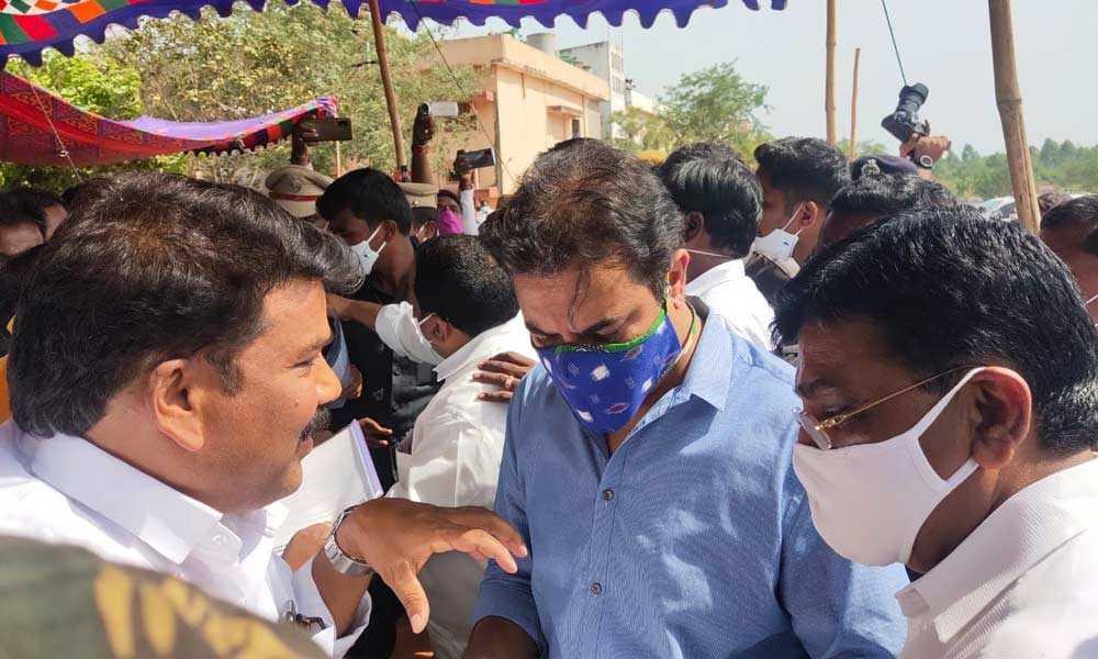 BJP Sathupalli in-charge N Rama Lingeswara Rao explaining the problems of open cast mines to Minister KT Rama Rao in Sathupalli on Friday