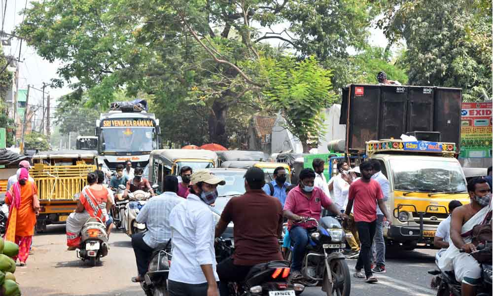 Vehicles moving violating traffic rules in Rajamahendravaram on Friday