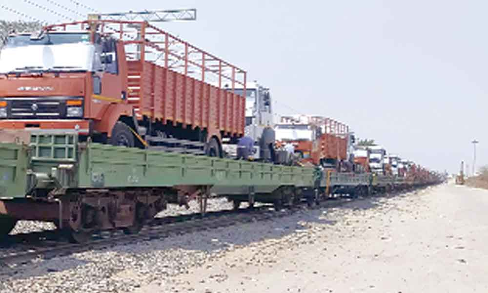 South Western Railway ferries 64 truck chasis in single rake to Haryana