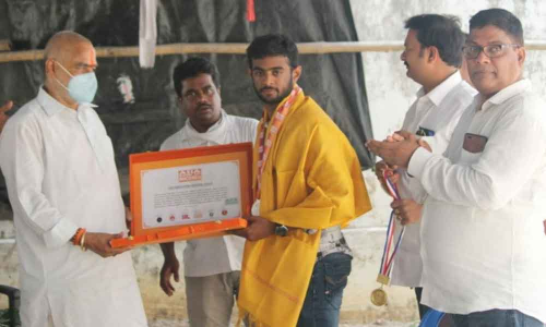 Speaker  T Sitaram felicitating award winner Pranay Teja