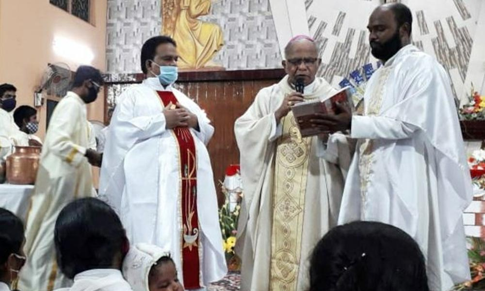 Bishop T Joseph Rajarao offering prayers on the occasion of Easter at St Pauls Cathedral in Vijayawada on Sunday