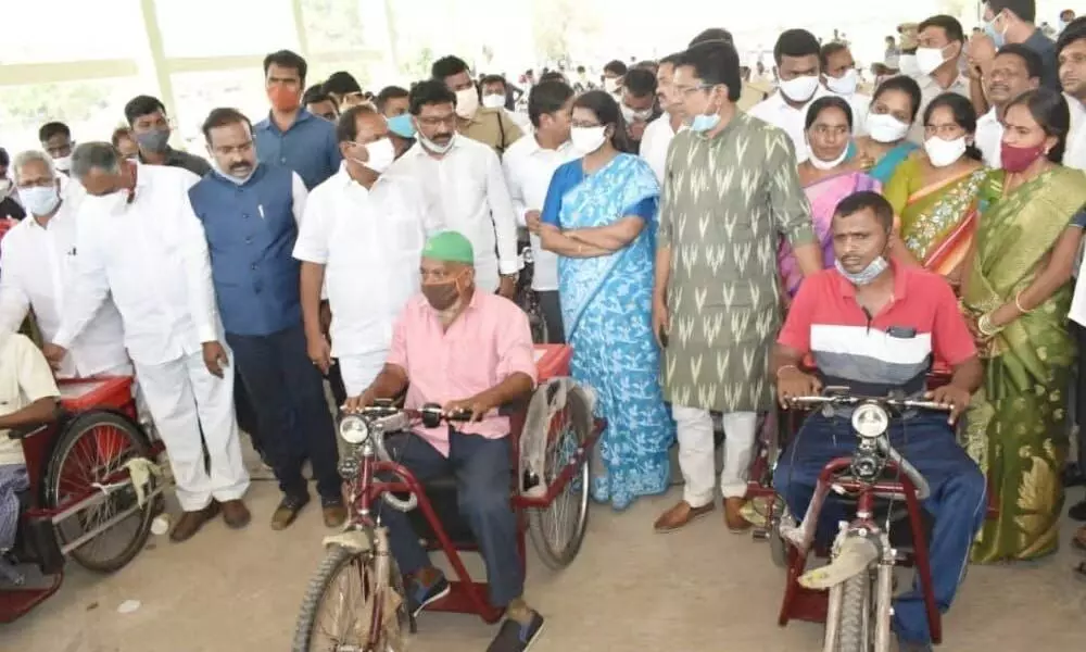 Koppula Eshwar distributes physical aides to disabled